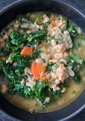 A picture of White Bean Soup with Turkey, Kale, and Lemon.