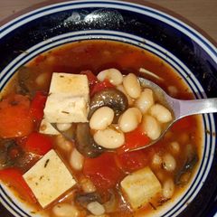 A picture of Earthy bean stew with tofu chunks.