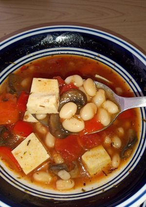 A picture of Earthy bean stew with tofu chunks.