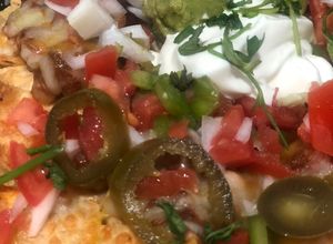 Foto principal de Nachos con chili, pico de gallo y queso (como los de Foster Hollywood)