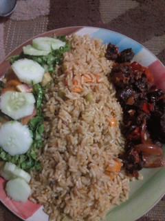 A picture of Fried rice and pepper meat and salad.