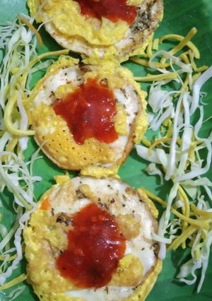A picture of Egg mini dosa with Schezwan chutney.