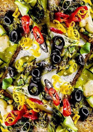 A picture of Broccoli Pizza with Zucchini.
