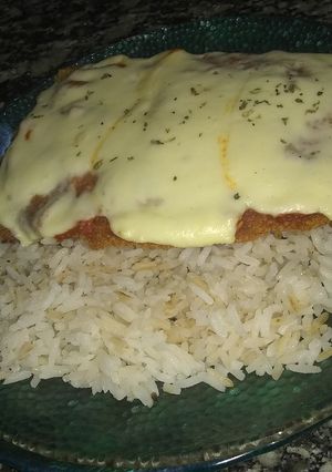 Una foto de Milanesas a la napolitana con Arroz graneado