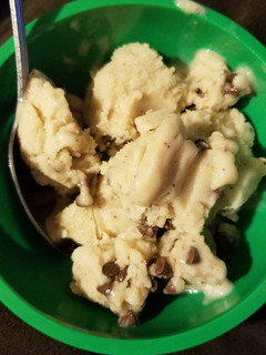 A picture of Banana ice cream with chocolate chips.
