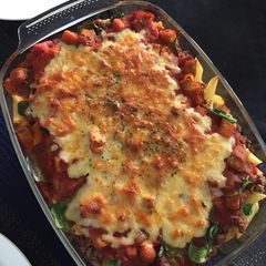 A picture of Baked meaty pasta with spinach,tomato and aubergine.