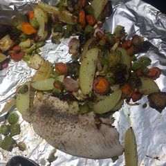 A picture of Sheet pan tilapia & vegetable medley.
