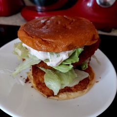 A picture of My Double Chicken in Breadcrumbs Burger on a Bun.