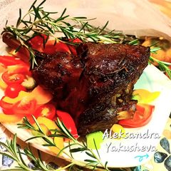 A picture of Lamb shank with rosemary.