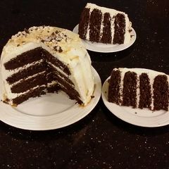 A picture of Mocha Layer Cake with Whipped Mascarpone Cream and a Coffee Glaze Drizzle.