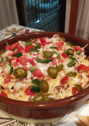 Una foto de Nachos supremos bien ricos😋😋