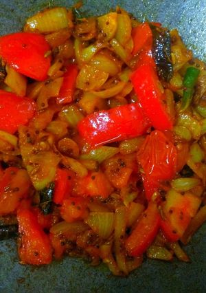A picture of Sweet and sour  Tomatoes and onion sabzi.