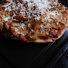A picture of Baked French fries wheat base pizza.