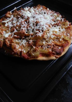 A picture of Baked French fries wheat base pizza.