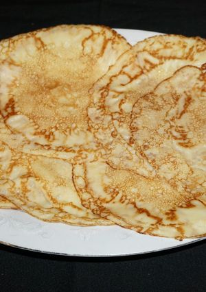 A picture of CREPES OR VERY THIN PANCAKES. JON STYLE.