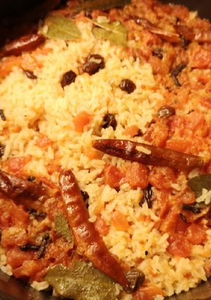 A picture of Raisin chili tomatoes rice.