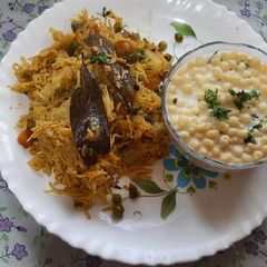 A picture of Mix vegetables pulao with boondi raita.