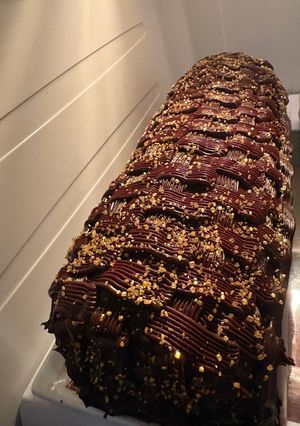 Una foto de Arrollado de dulce de leche, bañado con ganache de chocolate