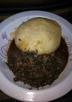 A picture of Vegetable soup and eba.