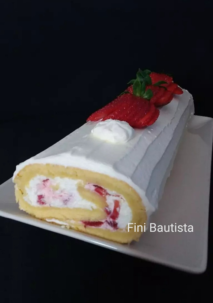 Una foto de Brazo gitano de fresas con nata