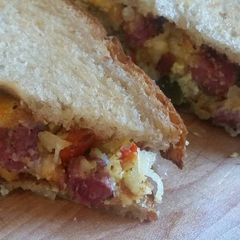 A picture of Midwest Corned Beef & Egg Hash on Rye.