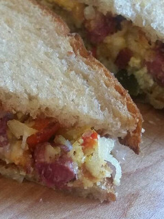 A picture of Midwest Corned Beef & Egg Hash on Rye.