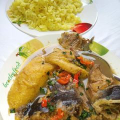 A picture of Tumeric and mustard seed rice, served with cat fish pepper soup.