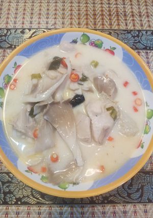 A picture of Tom Kha Gai with Oyster Mushrooms.