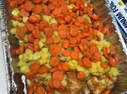 A picture of roast with carrots and potatoes
