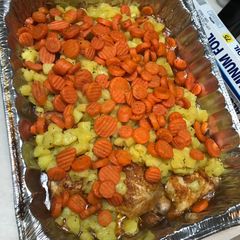 A picture of Baked Chicken w/ potatoes and carrots.