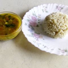 A picture of Jeera rice with chana dal curry.