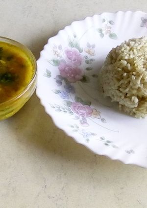 A picture of Jeera rice with chana dal curry.