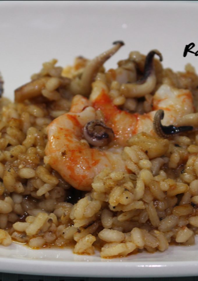 Una foto de Arroz a banda
