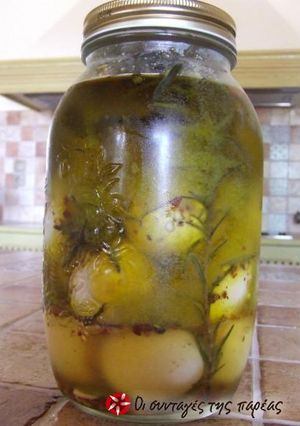 A picture of Pickled boiled eggs with herbs.