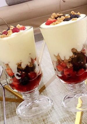 A picture of Fruit salad parfait with shortbread cookie crumble.