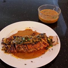 A picture of Roast Pork Tenderloin with a Green Peppercorn Cream Sauce.