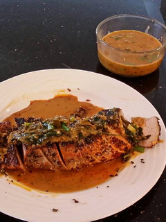 A picture of Roast Pork Tenderloin with a Green Peppercorn Cream Sauce.