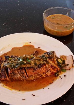 A picture of Roast Pork Tenderloin with a Green Peppercorn Cream Sauce.