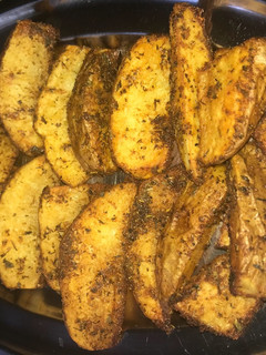 Una foto de Patatas gajo al horno con toque de Curry