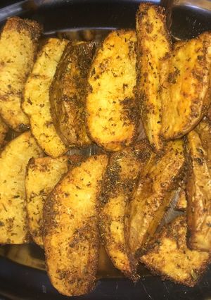 Una foto de Patatas gajo al horno con toque de Curry