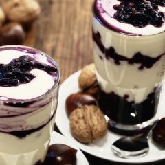 A picture of White chocolate cream with blueberries.