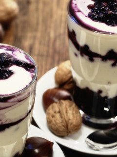 A picture of White chocolate cream with blueberries.
