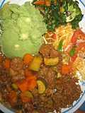 Mukimo served with beef stew and green vegetables