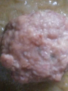 Una foto de Hamburguesa de cerdo en salsa de cebolla