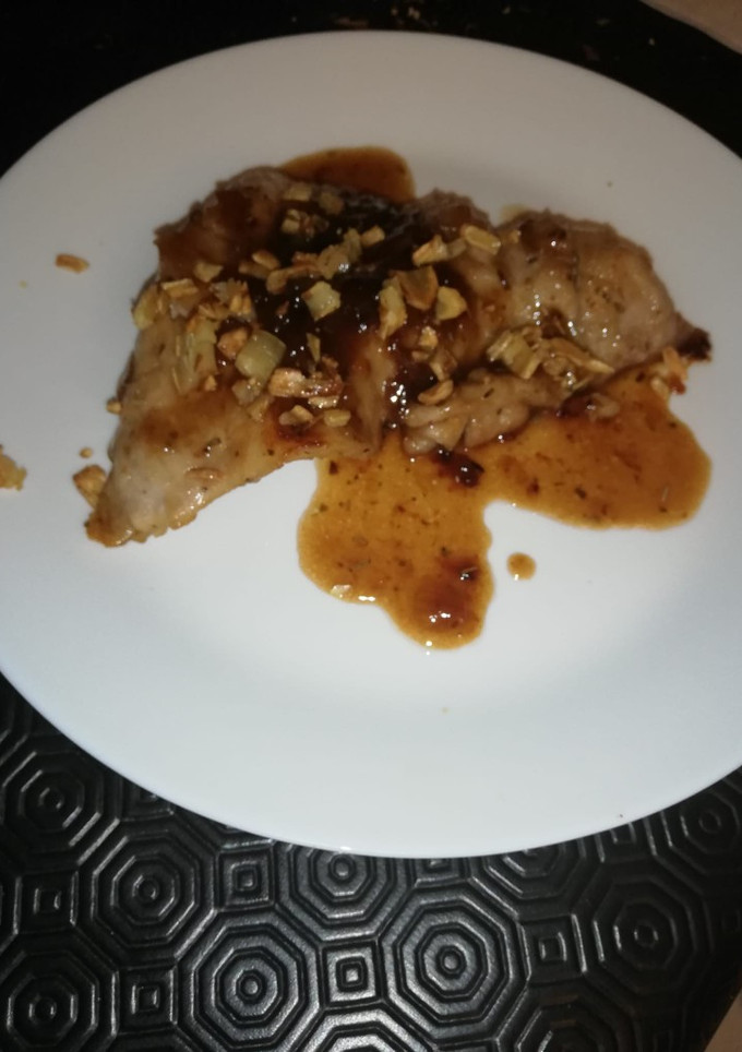 Una foto de Secreto ibérico con cebolla caramelizada y ajitos