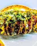 Papas bandoneon con panceta y queso parmesano