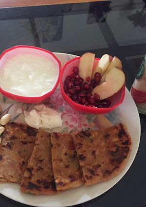 A picture of #Breakfast#Paneer Soya parantha with curd and butter.