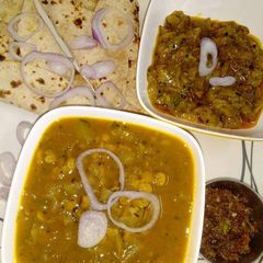Ghiya chana dal, achari torai and chapati with mirch pickle A picture of Ghiya chana dal, achari torai and chapati with mirch pickle.