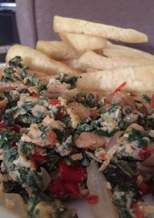 A picture of Fried yam with spinach.