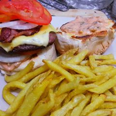 A picture of Cheese and bacon Burger and Fries.